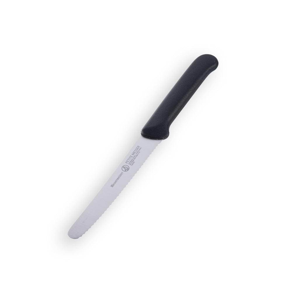 Angled view of 4.5-inch black serrated tomato knife showing stainless steel blade and ergonomic handle, no sheath