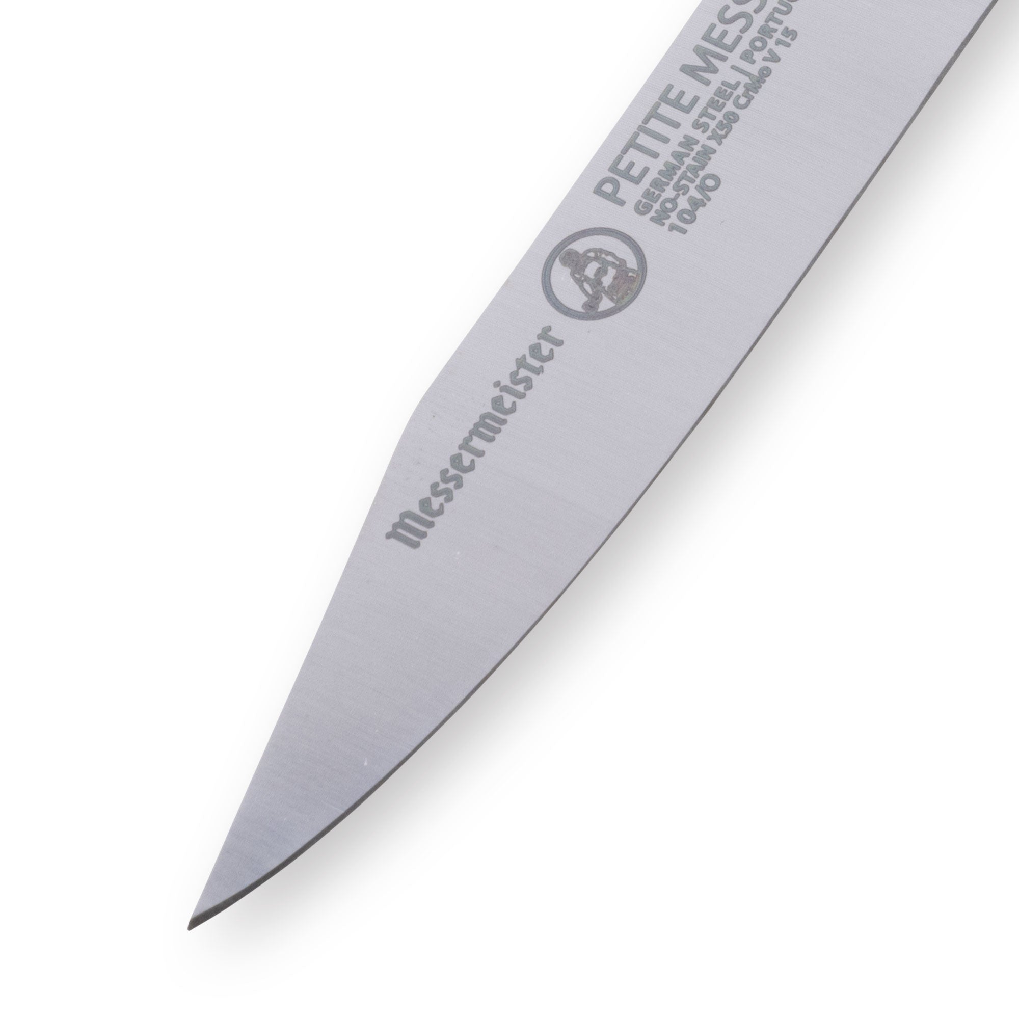 Close-up of Messermeister Petite Messer orange clip point paring knife tip showing sharp precision point