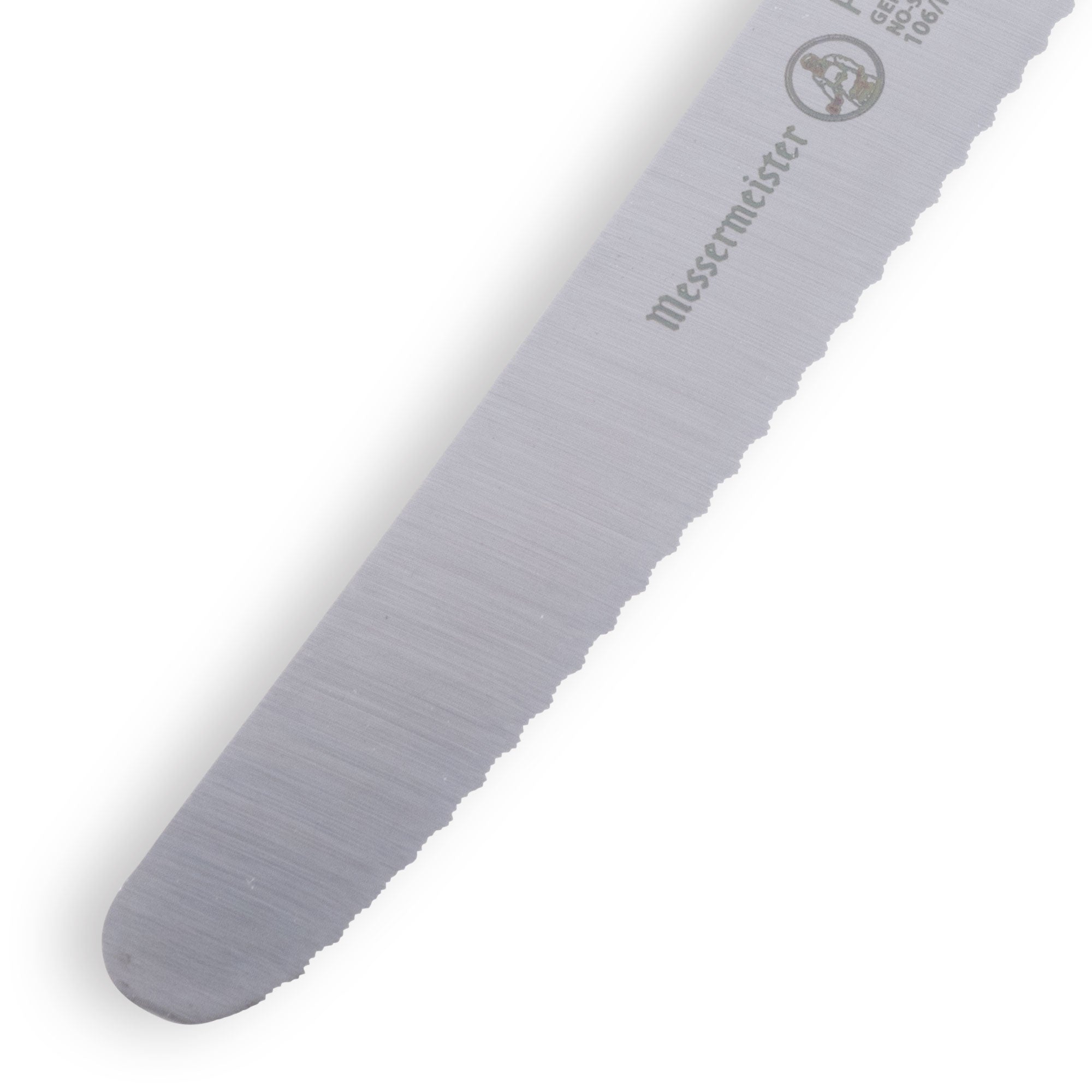 Close up of Messermeister Petite Messer red serrated tomato knife tip showing sharp pointed stainless steel edge