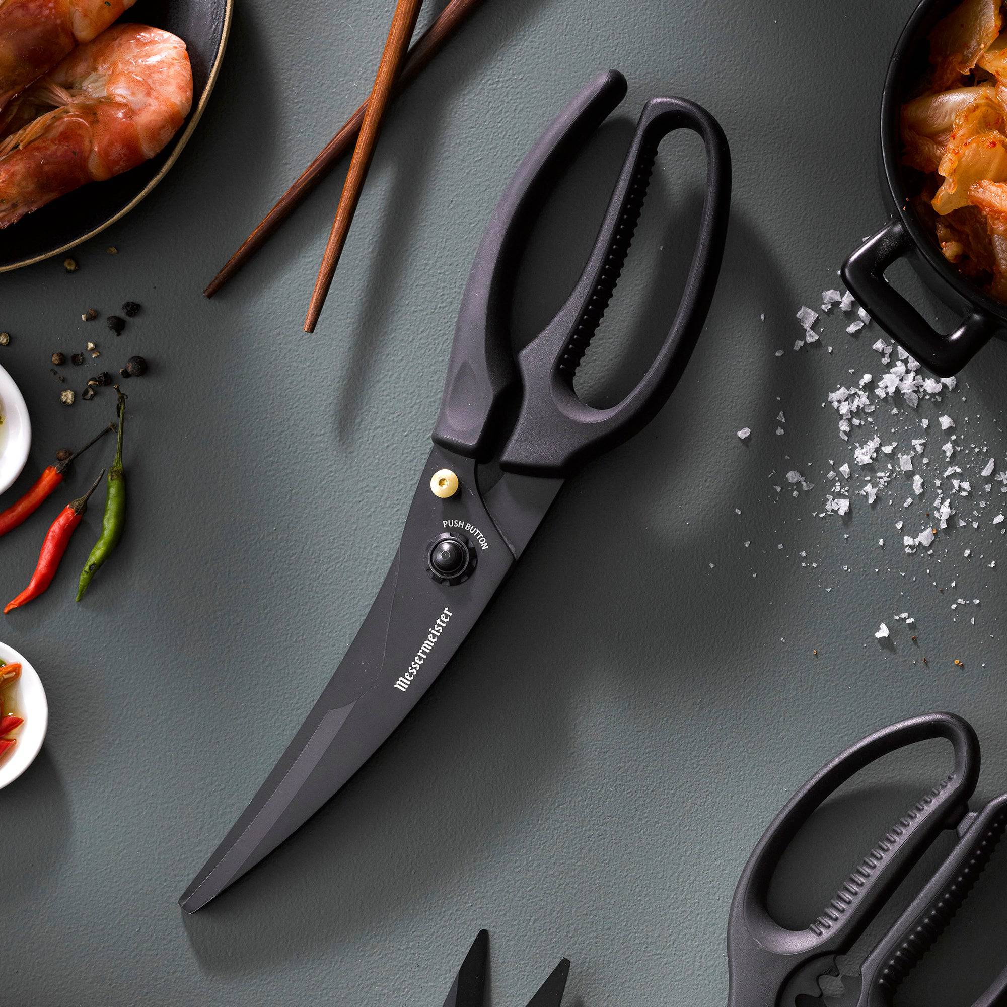 10-inch push button take-apart poultry shears with stainless steel blades and ergonomic handles on a gray background beside a bowl of shrimp, wooden chopsticks, and red chili peppers, styled for seafood and kitchen prep use