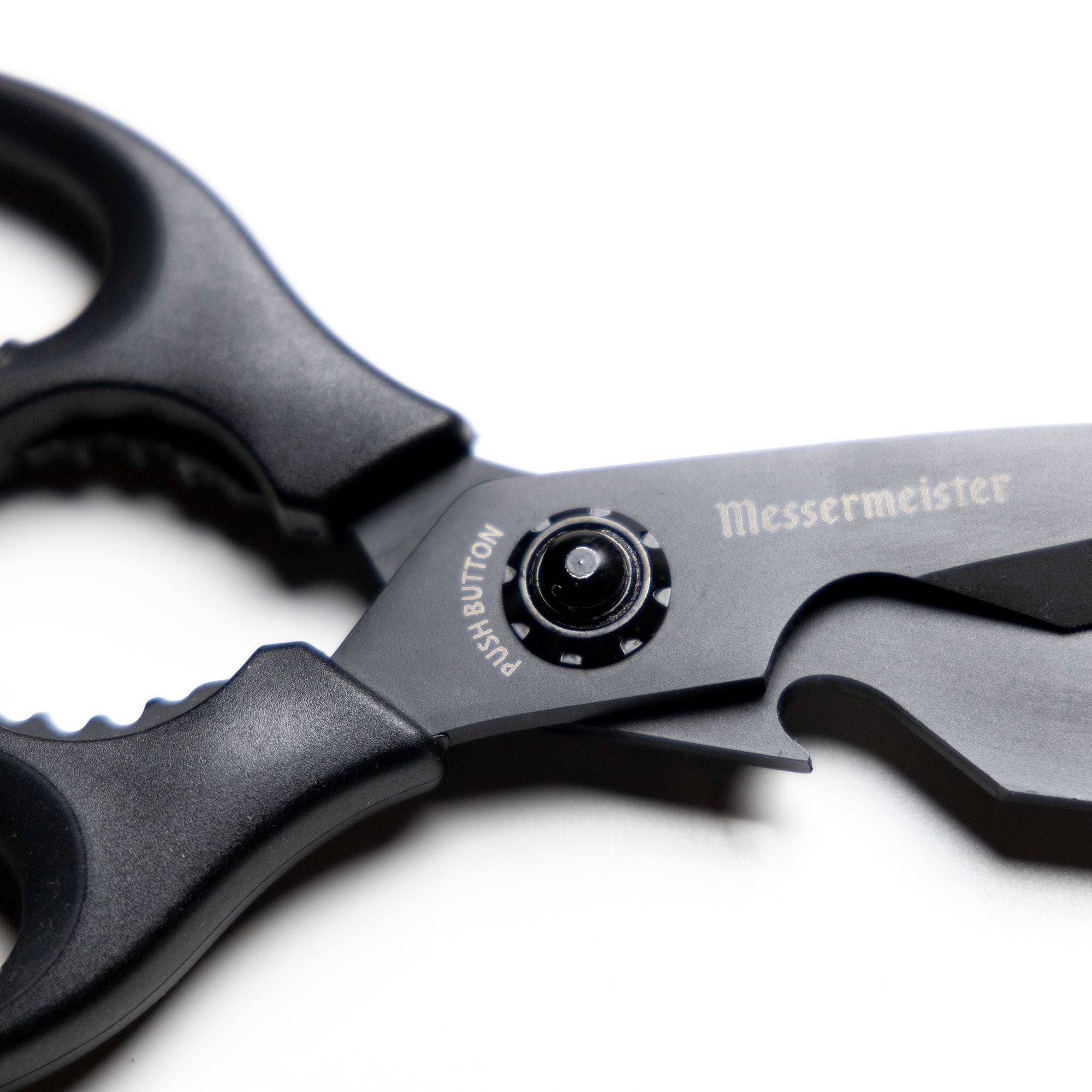 Close-up of the push-button release mechanism on 9-inch take-apart shears, highlighting the secure locking system and easy-detach design for quick disassembly and cleaning.