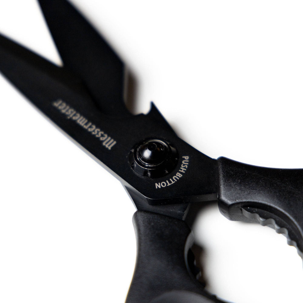 Close-up of the push-button release mechanism on 9-inch take-apart shears, highlighting the secure locking system and easy-detach design for quick disassembly and cleaning.