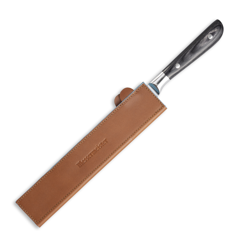 Messermeister 10.5 inch Saddle Brown Leather Magnetic Edge Guard  Soft Rubber Magnets to Secure Knife on a plain background on an ebony pakkawood handled knife