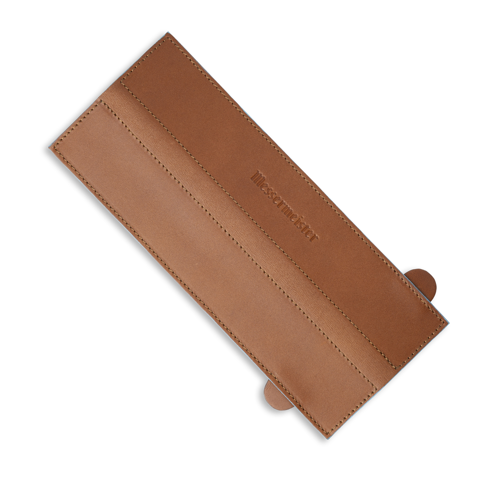 Messermeister 10.5 inch Saddle Brown Leather Magnetic Edge Guard Soft Rubber Magnets to Secure Knife on a plain background laid out flat