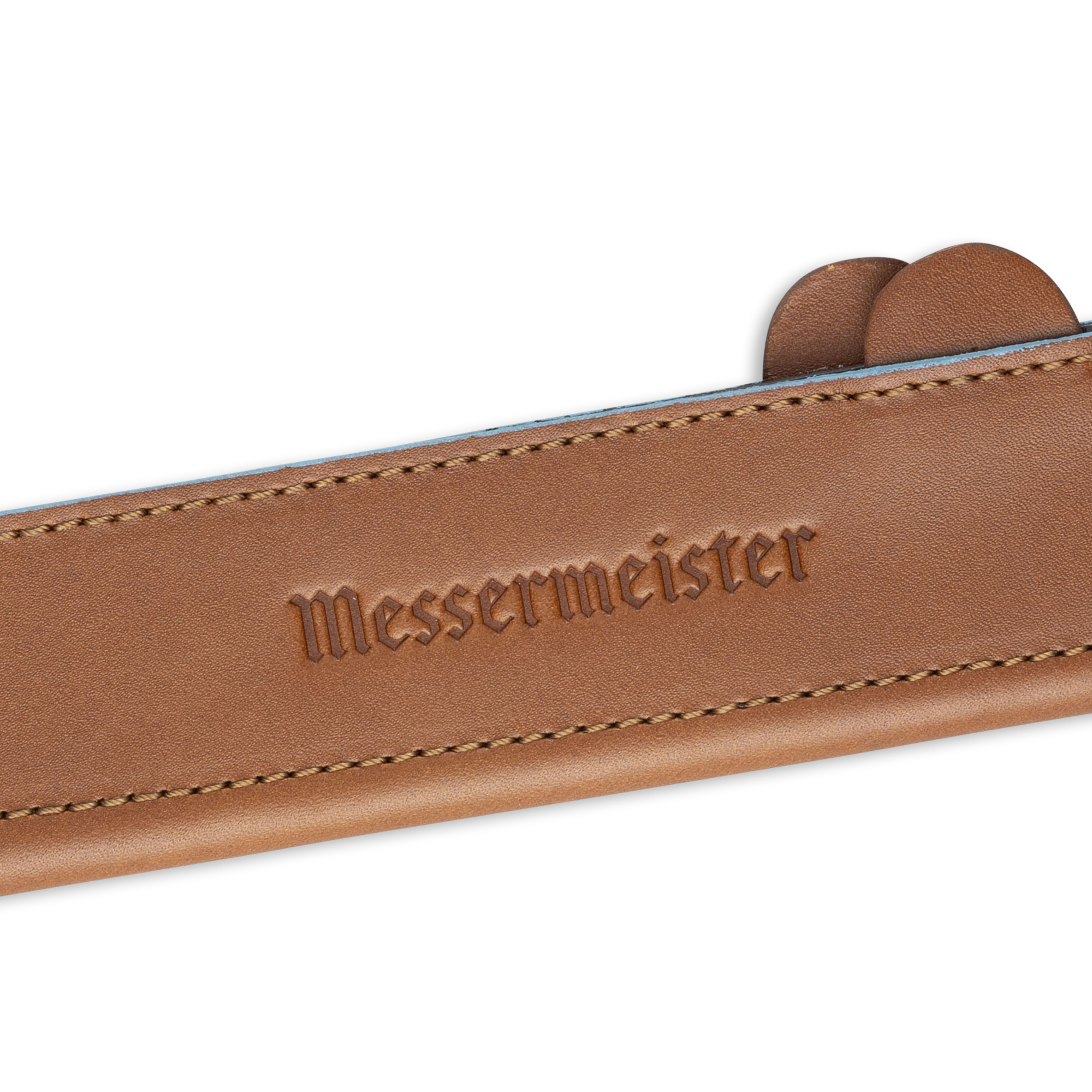 Messermeister 6.5 inch Saddle Brown Leather Magnetic Edge Guard Soft Rubber Magnets to Secure Knife close up on logo
