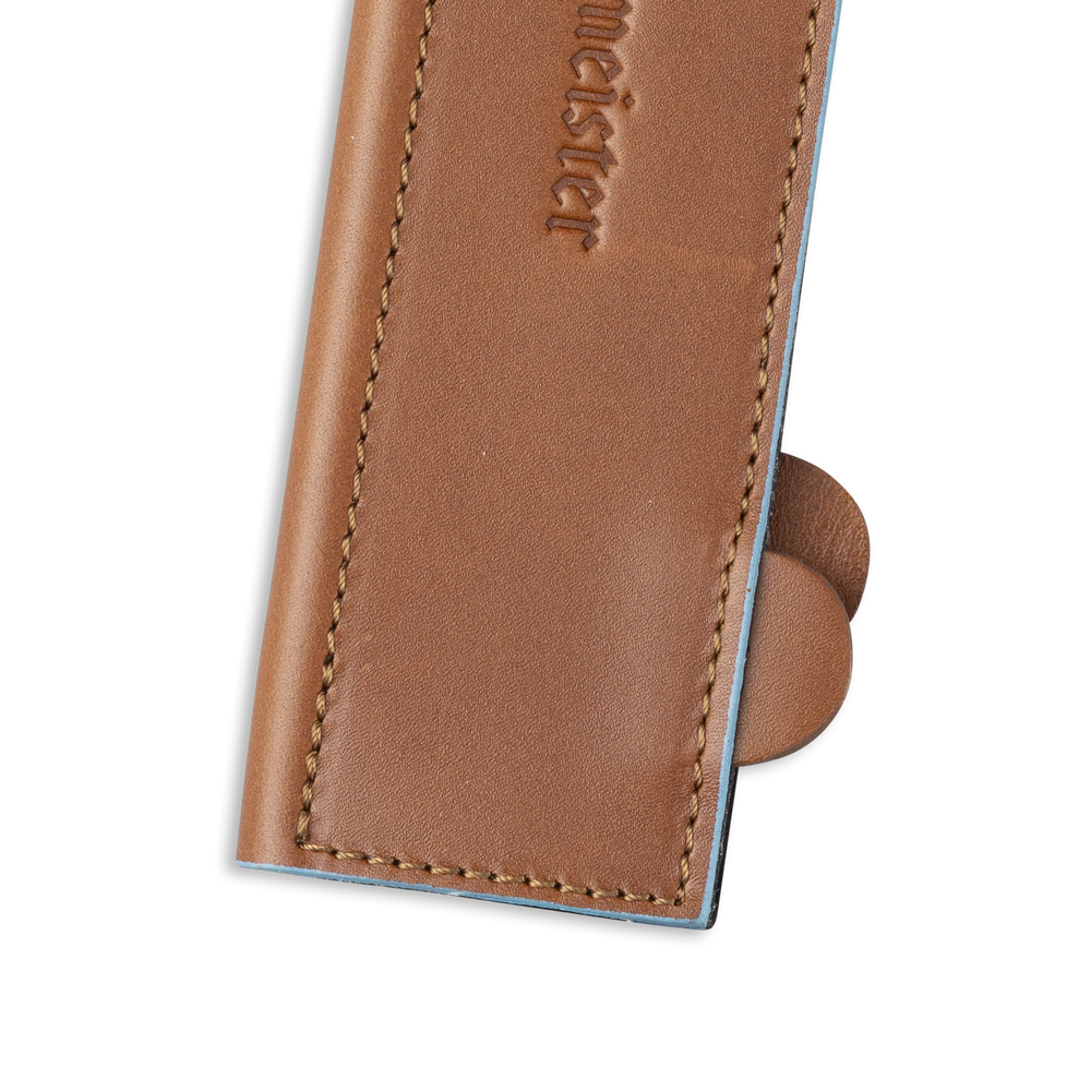 Messermeister 8.5 inch Saddle Brown Leather Magnetic Edge Guard Soft Rubber Magnets to Secure Knife close up on opener tabs