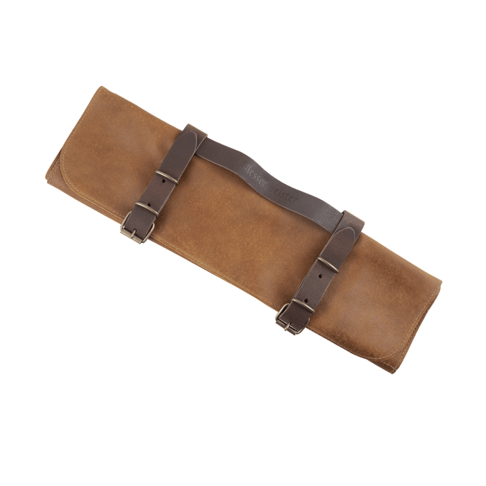 Messermeister Vintage Leather 7 Pocket Knife Roll in amber brown, featuring premium full-grain leather construction with seven individual knife pockets, secure buckle closures, reinforced stitching, and a roll-up design for safely storing and transporting chef knives and culinary tools