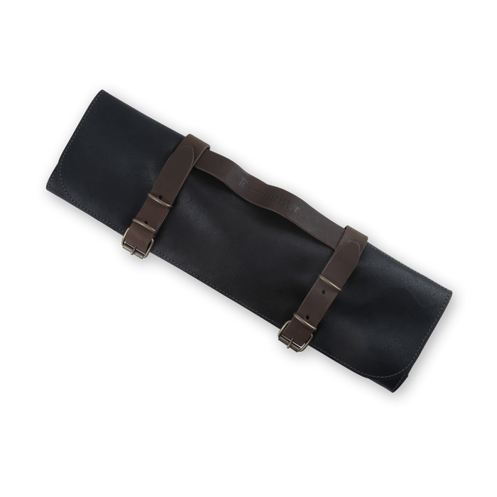 Messermeister Vintage Leather 7 Pocket Knife Roll in black, featuring durable full-grain leather construction with secure buckle closures, seven individual knife slots, reinforced stitching, and a compact roll-up design for safely storing and transporting chef knives and culinary tools