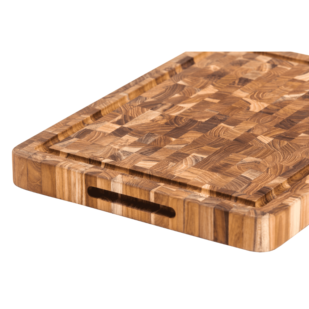 Top view of Teakhaus butcher block cutting board featuring a juice groove and built-in hand grips.