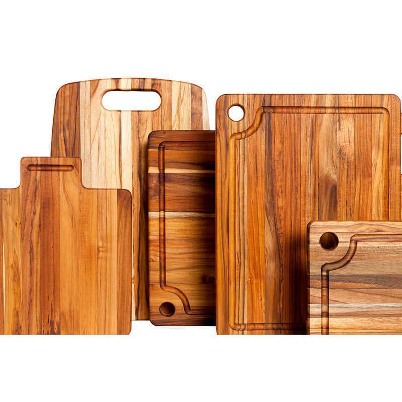 Teakhaus teak cutting boards in various sizes showcasing natural wood grain.