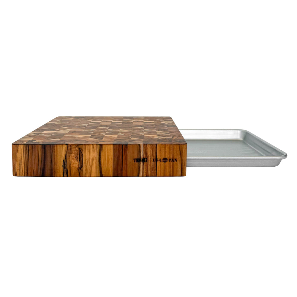 Teakhaus butcher block cutting board with a built-in pan for easy food transfer from board to pan to oven.