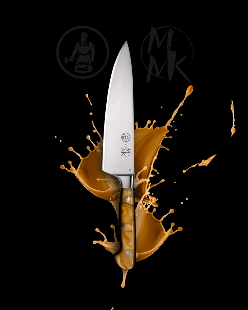 A professional chef's knife with a silver stainless steel blade and a marbled brown and cream handle, presented vertically against a black background with a dynamic golden-brown liquid splash behind it. The 'MK' brand logo is visible on the blade and as a watermark in the background.