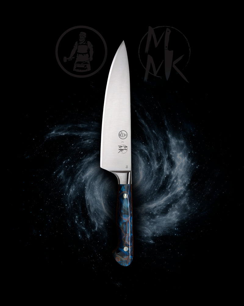 A professional chef's knife with a silver stainless steel blade and a blue marbled handle, centered against a dark cosmic background with a spiral galaxy pattern and stylized brand logos.
