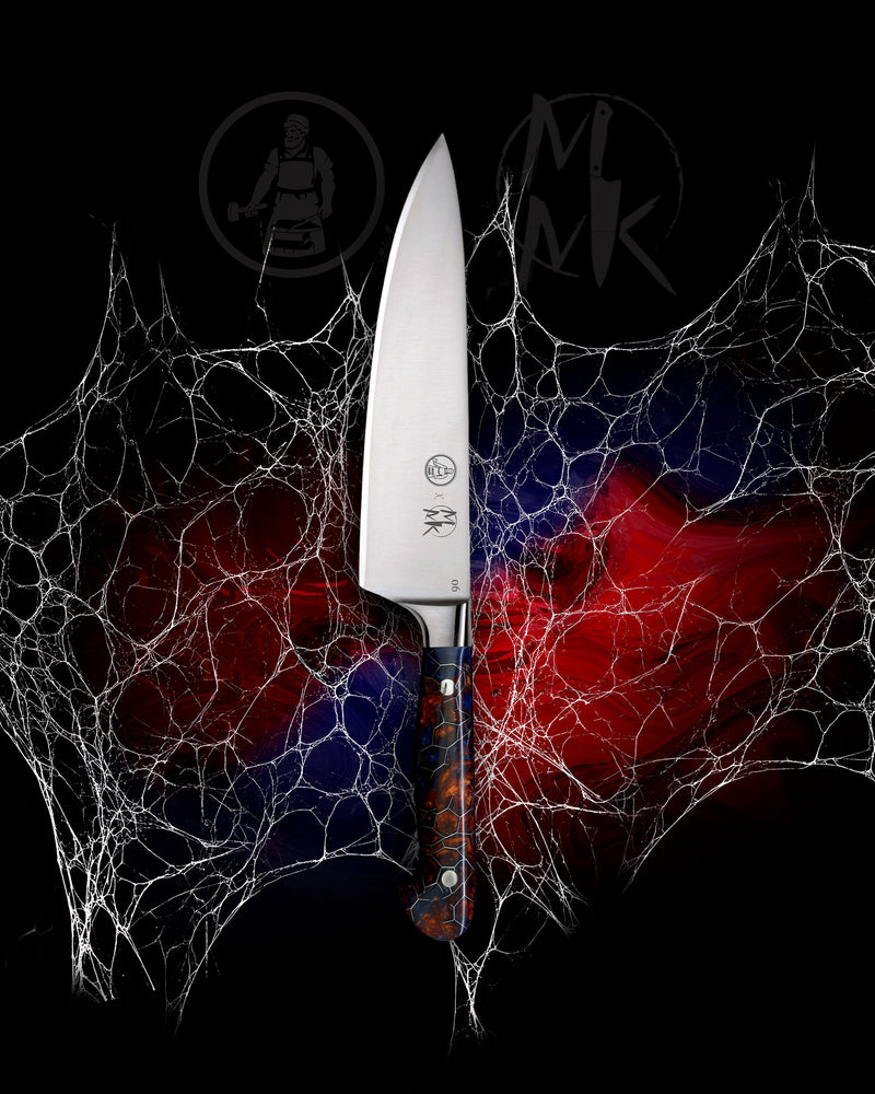A kitchen knife with a silver blade and a blue, red, and black patterned handle, centered against a black background with a white spiderweb graphic and red/blue blurred shapes behind it. The blade shows the brand logo 'MK'.
