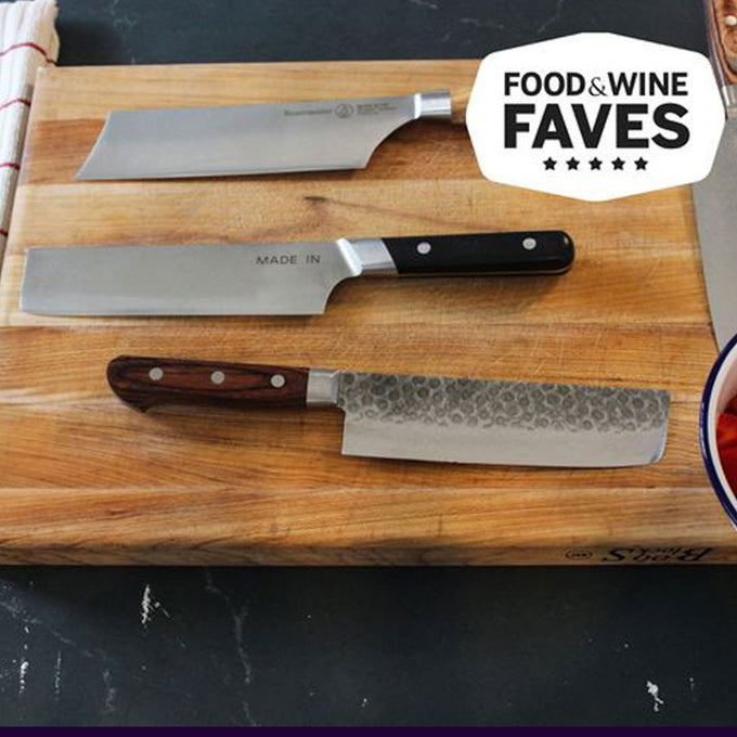 Three knives on a wooden cutting board with 'Food & Wine Faves' label.