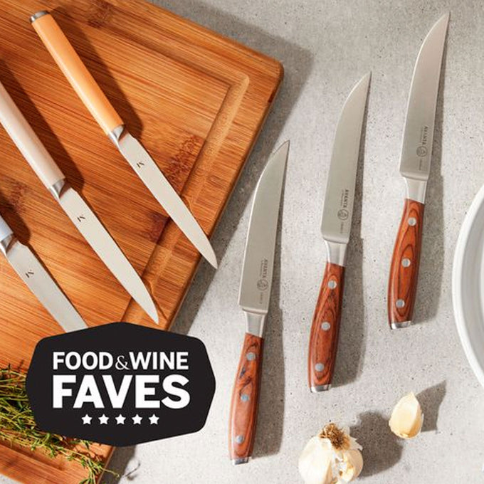 Set of knives with wooden handles on a gray surface, labeled 'Food & Wine Faves'.