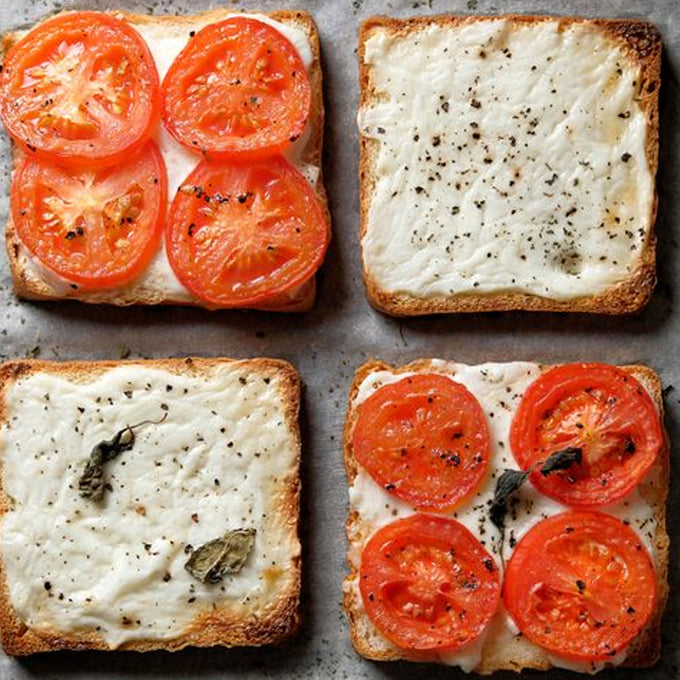 Tomato and Mayo Sandwiches open faced on gray background