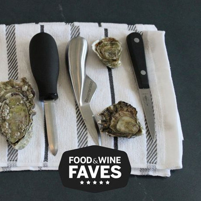 Oysters and oyster-opening tools on a striped towel with 'Food & Wine Faves' logo.