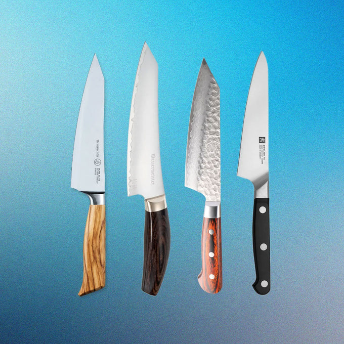 Four chef's knives with different handles on a blue gradient background