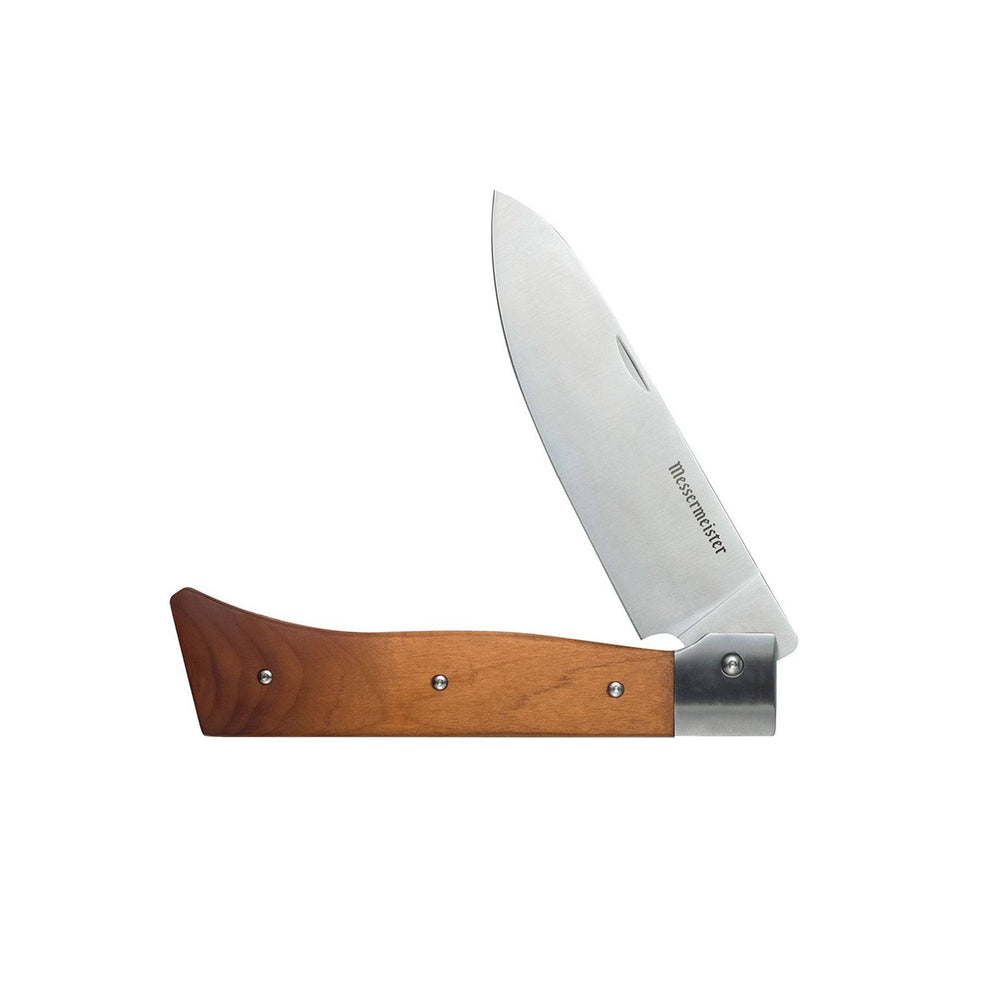 Messermeister Adventure Chef maple folding chef’s knife folded for safe travel and storage.