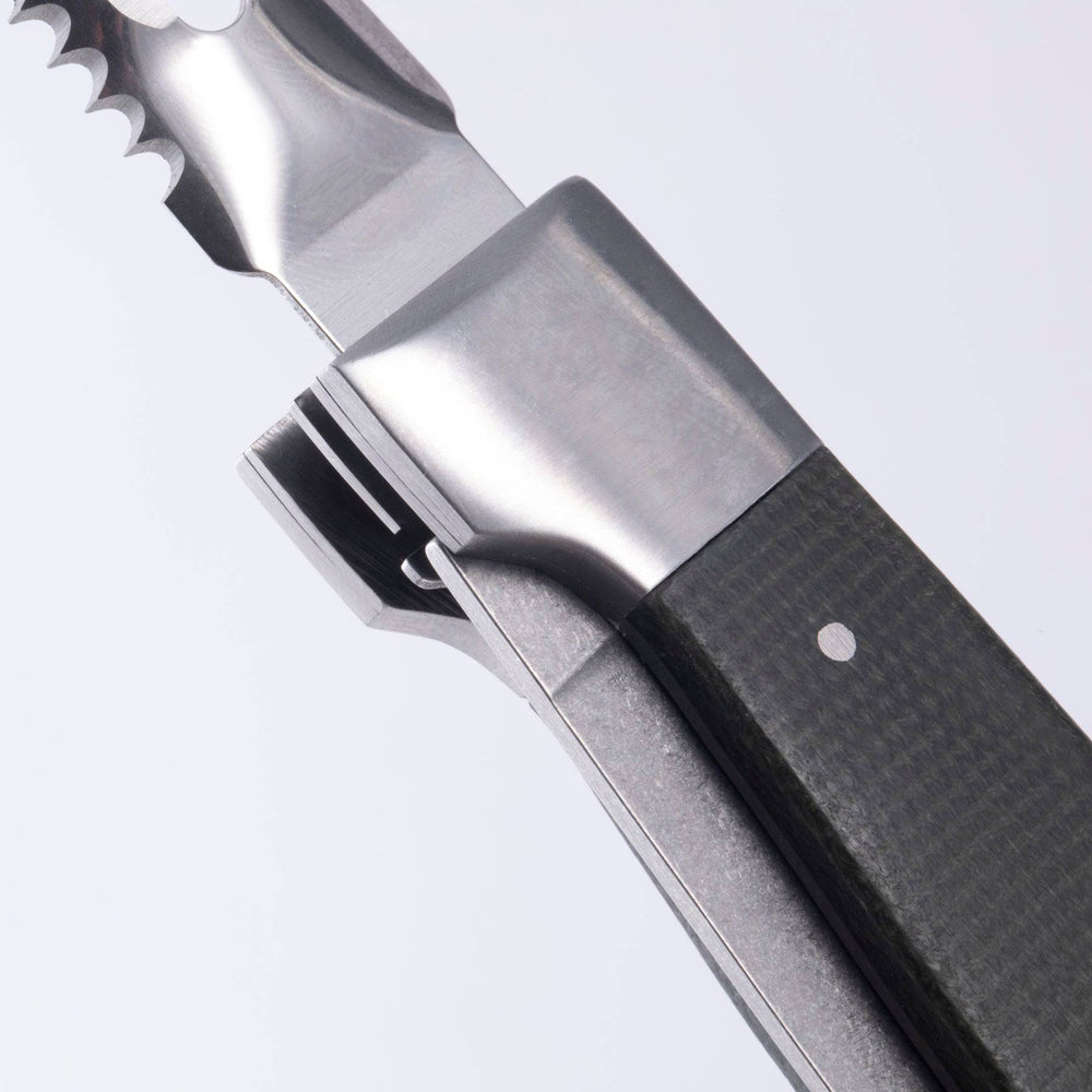 Close up view of the locking mechanism in the handle of the Messermeister Adventure Chef Folding Peeler and Parer