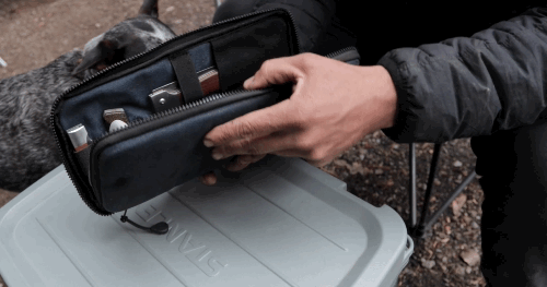 Video of person at a campsite opening the 6 piece Summit Set and pulling out the faux wood cutting board and the Adventure Chef 6 inch Chef's knife 