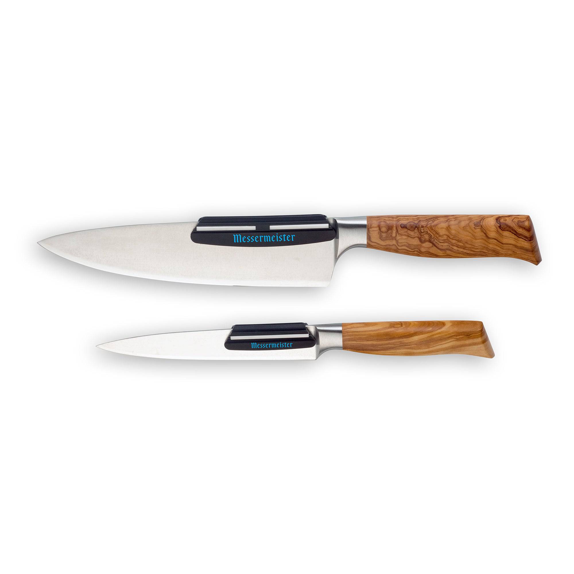Two wooden handled knives with a Messermeister Angle Guide on each blade. The knives are pointing to the left.
