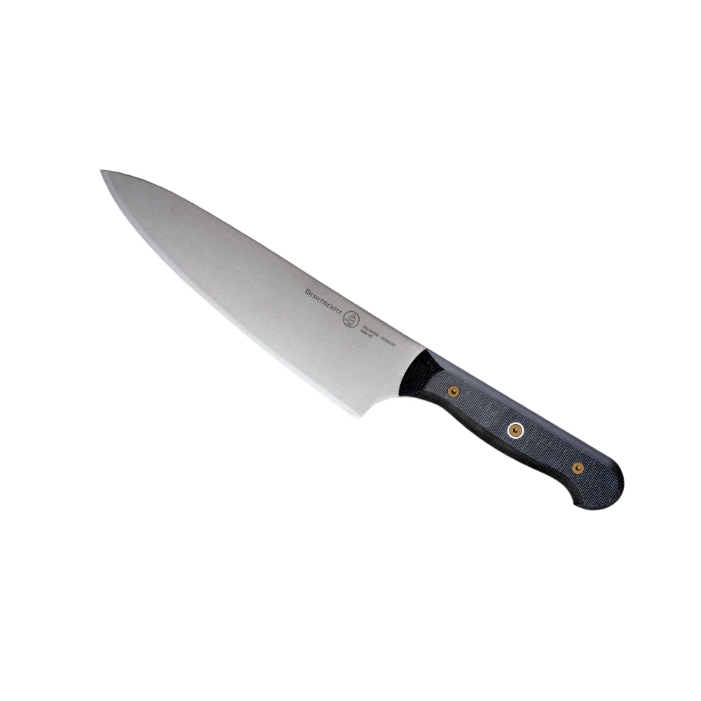 Angled view of Messermeister custom 8-inch chef’s knife highlighting sharp blade and ergonomic handle