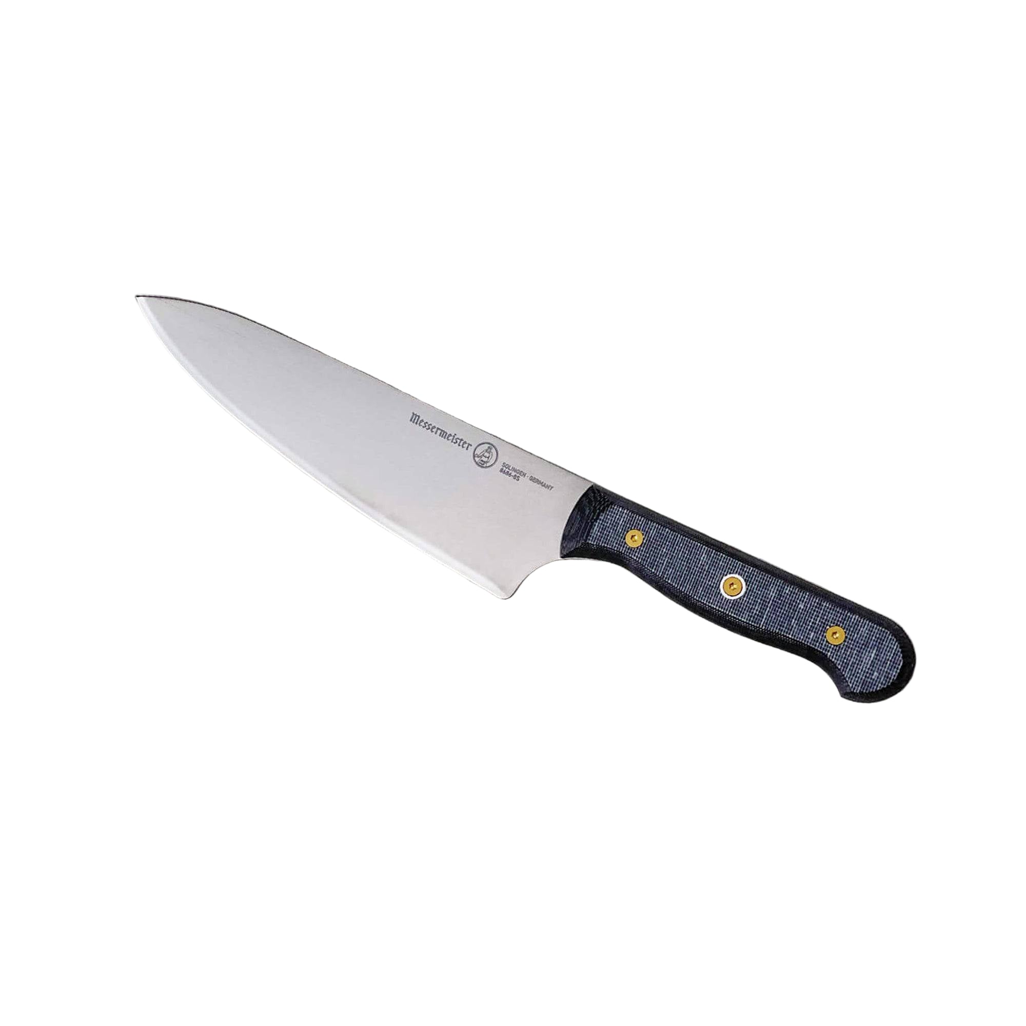 Messermeister custom chef knife angled view showing precision-forged stainless steel blade and ergonomic linen micarta handle