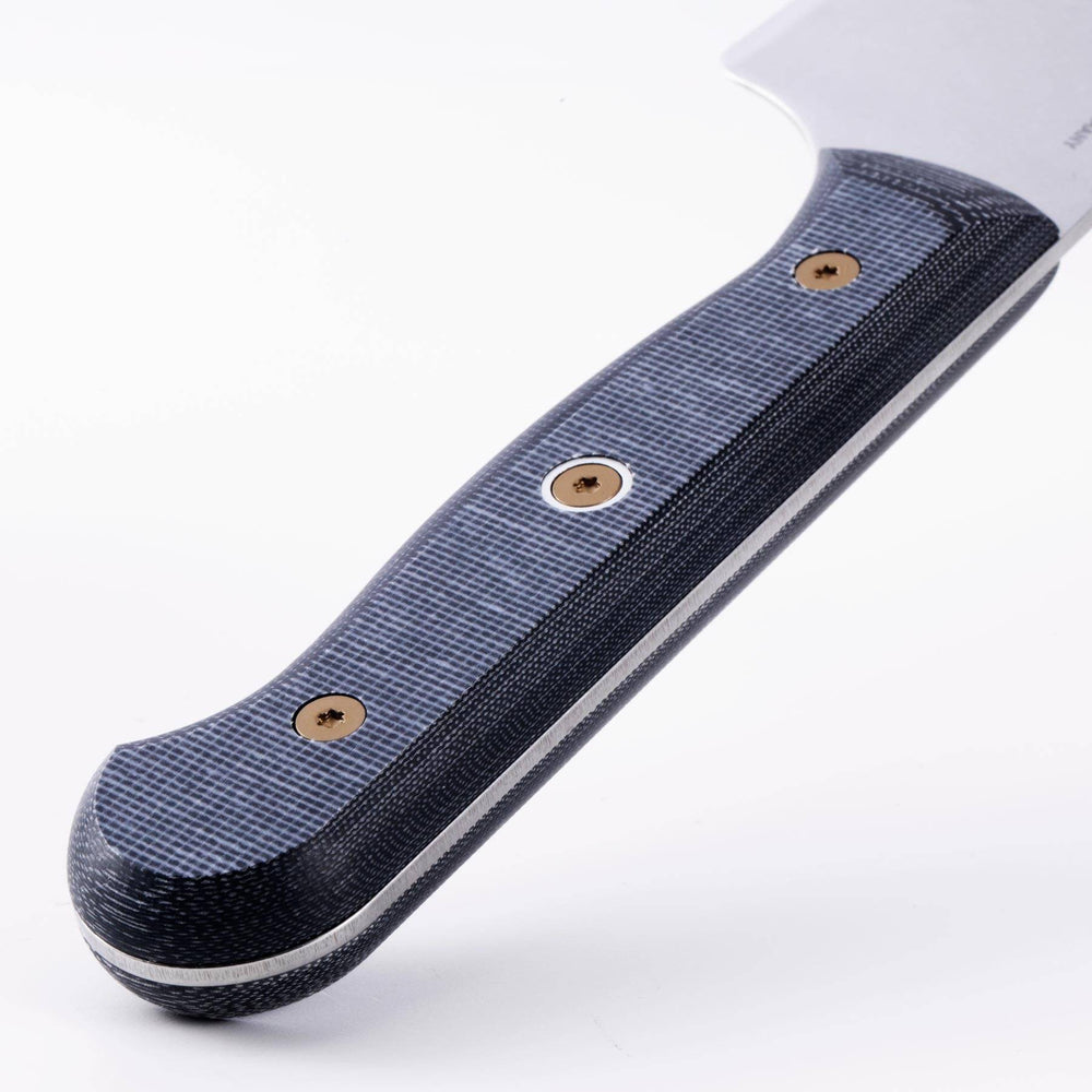 Close-up of Messermeister Custom Chefs knife linen Micarta knife handle showing textured grip and layered material