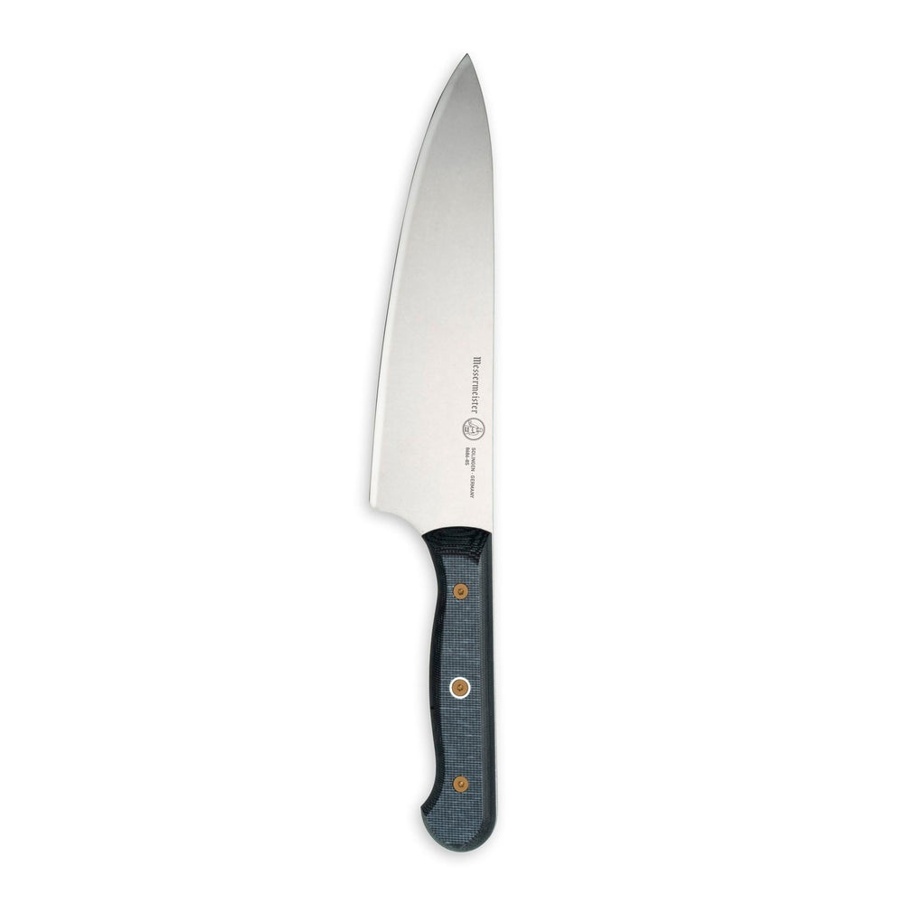 Close-up of Messermeister custom chef’s knife showing full stainless steel blade and Linen micarta handle
