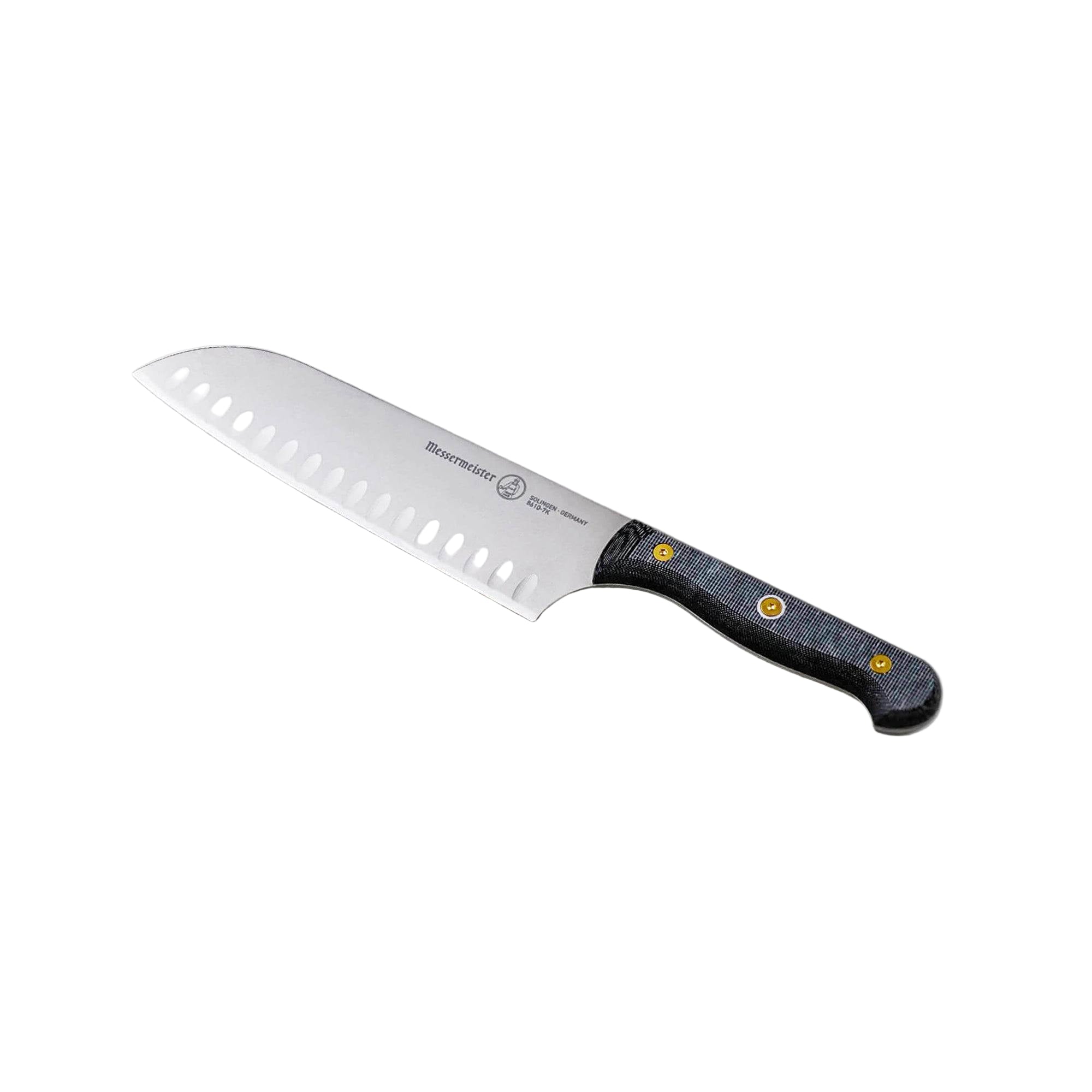 Messermeister 7-inch santoku knife angled up showing kullens (granton edge) and precision stainless steel blade and linen micarta handle