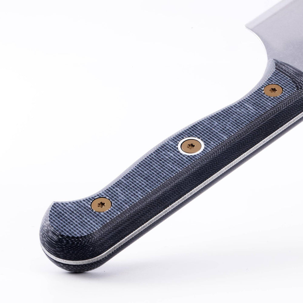 Close-up of handle texture on Messermeister custom nakiri knife showing ergonomic grip and material detail