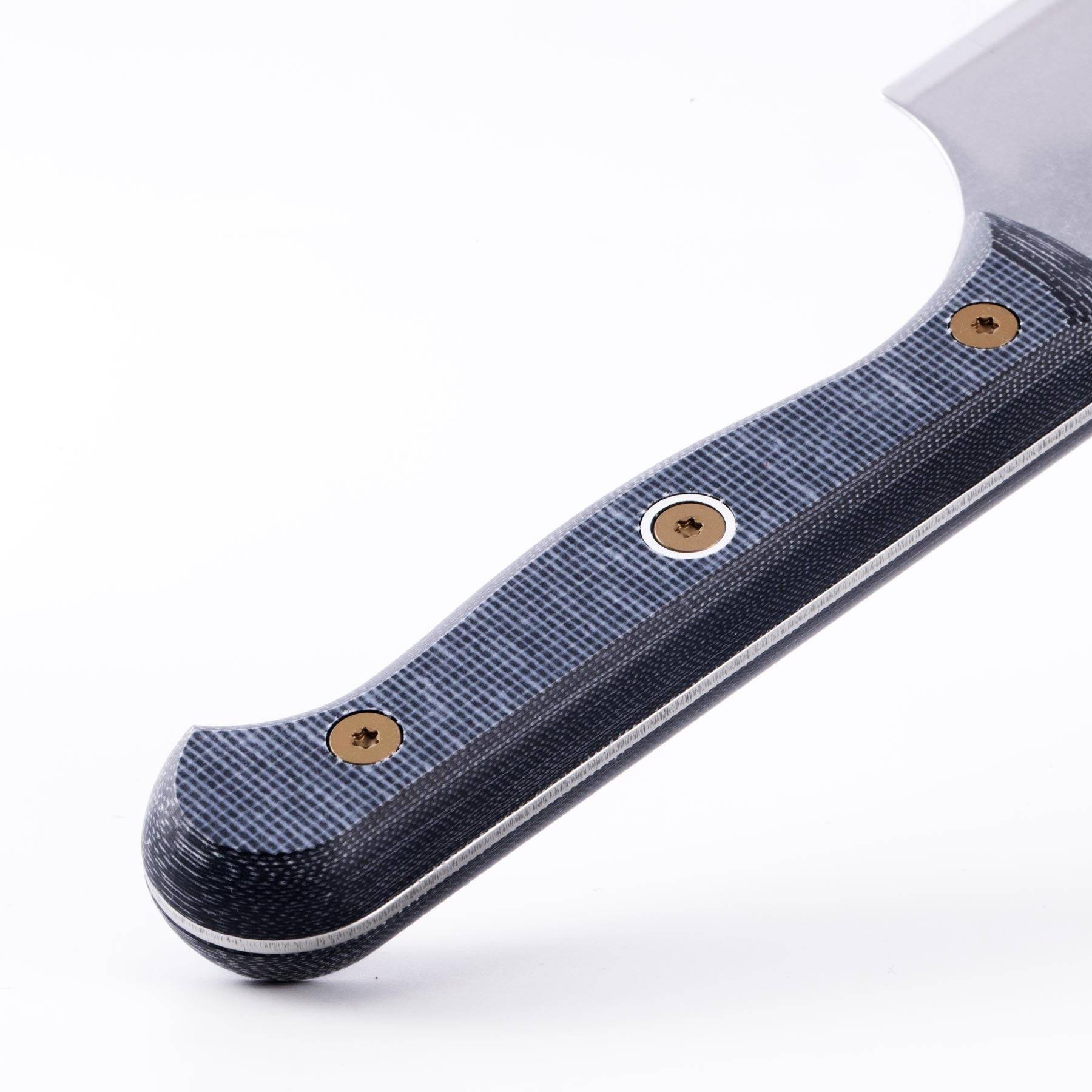Close-up of handle texture on Messermeister custom nakiri knife showing ergonomic grip and material detail