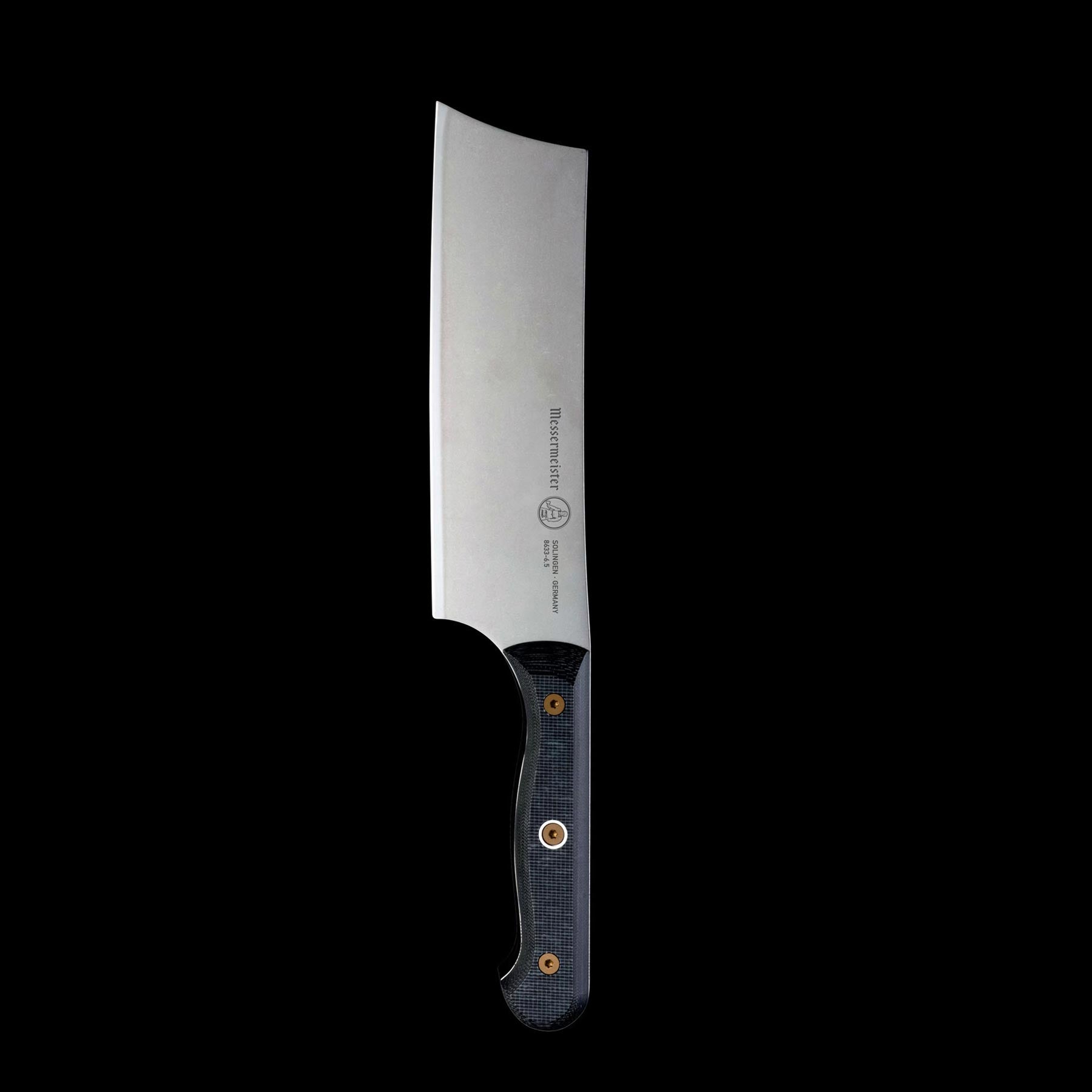 Upright close-up of Messermeister custom 6.5-inch nakiri knife showing flat blade and Linen Micarta ergonomic handle