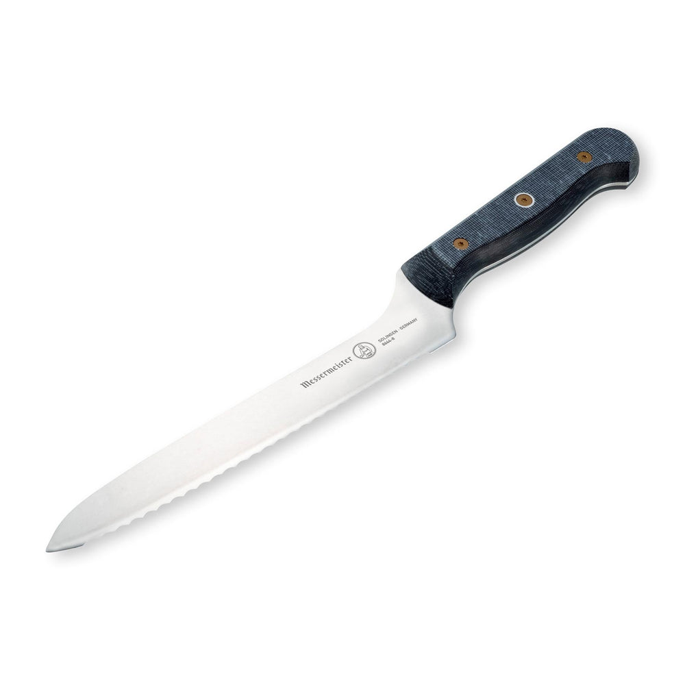 Angled view of Messermeister custom offset bread knife highlighting scalloped serrated edge and offset handle design