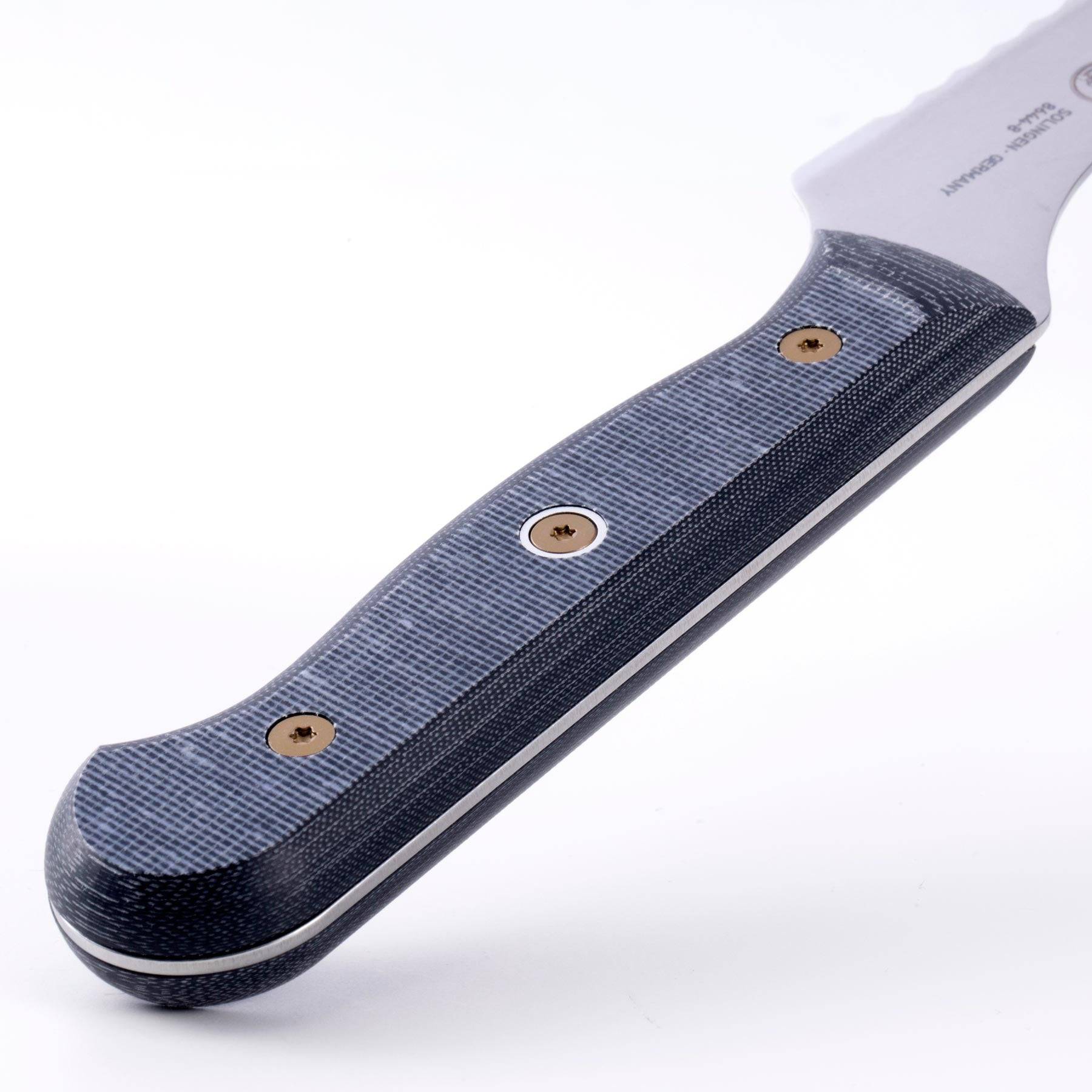 Close-up of Messermeister custom offset bread knife handle highlighting linen micarta textured ergonomic grip