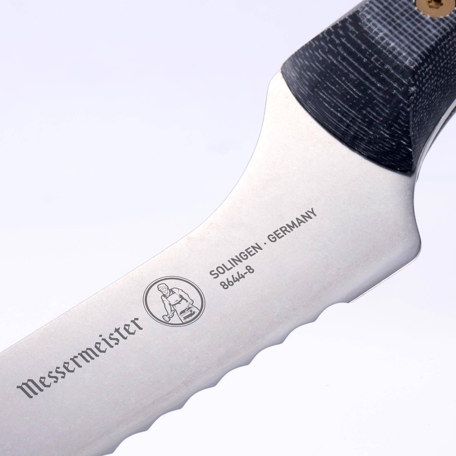 Close-up of Messermeister custom offset bread knife logo and heel detail with stainless steel blade