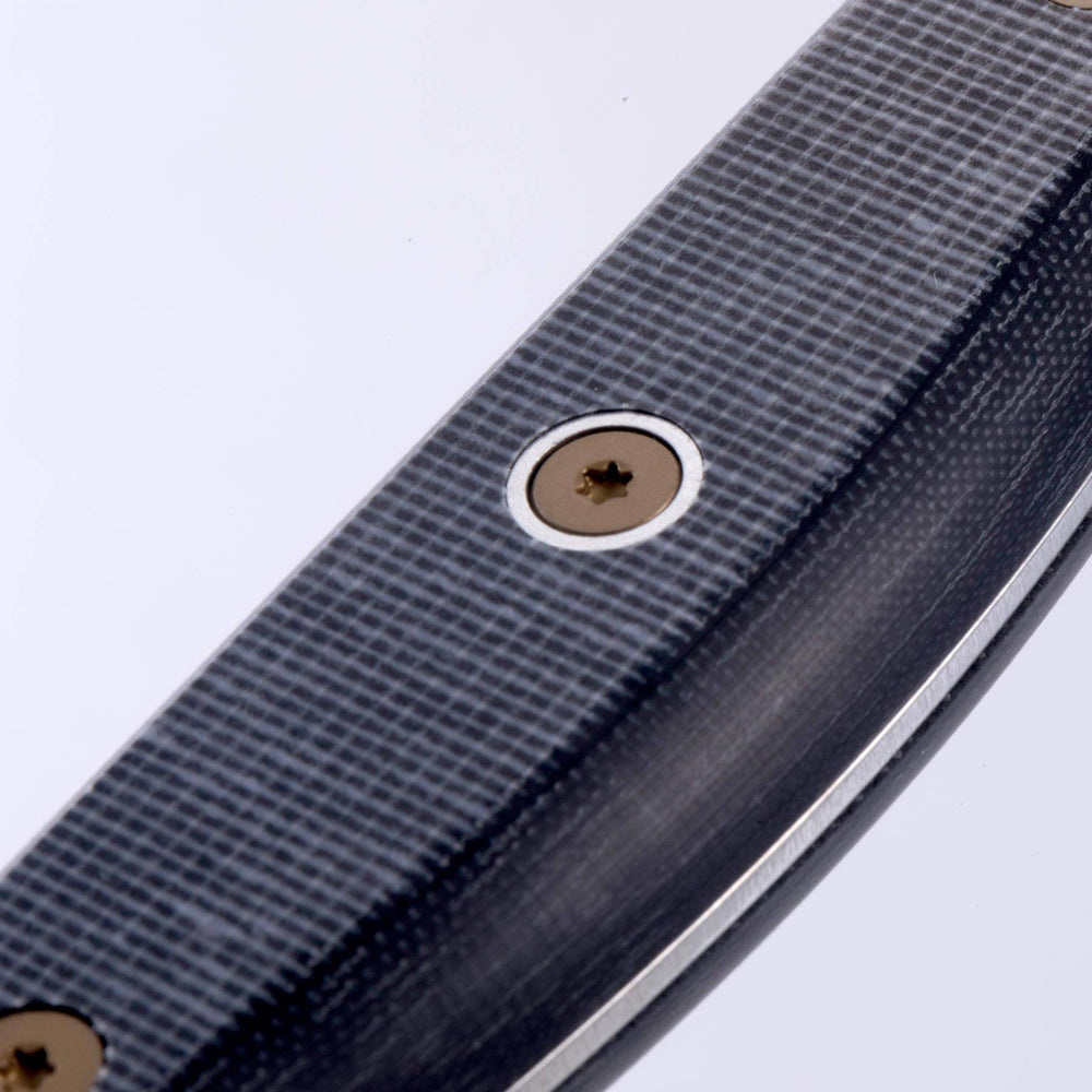 Close-up of knife handle highlighting removable rivets and precision handle construction
