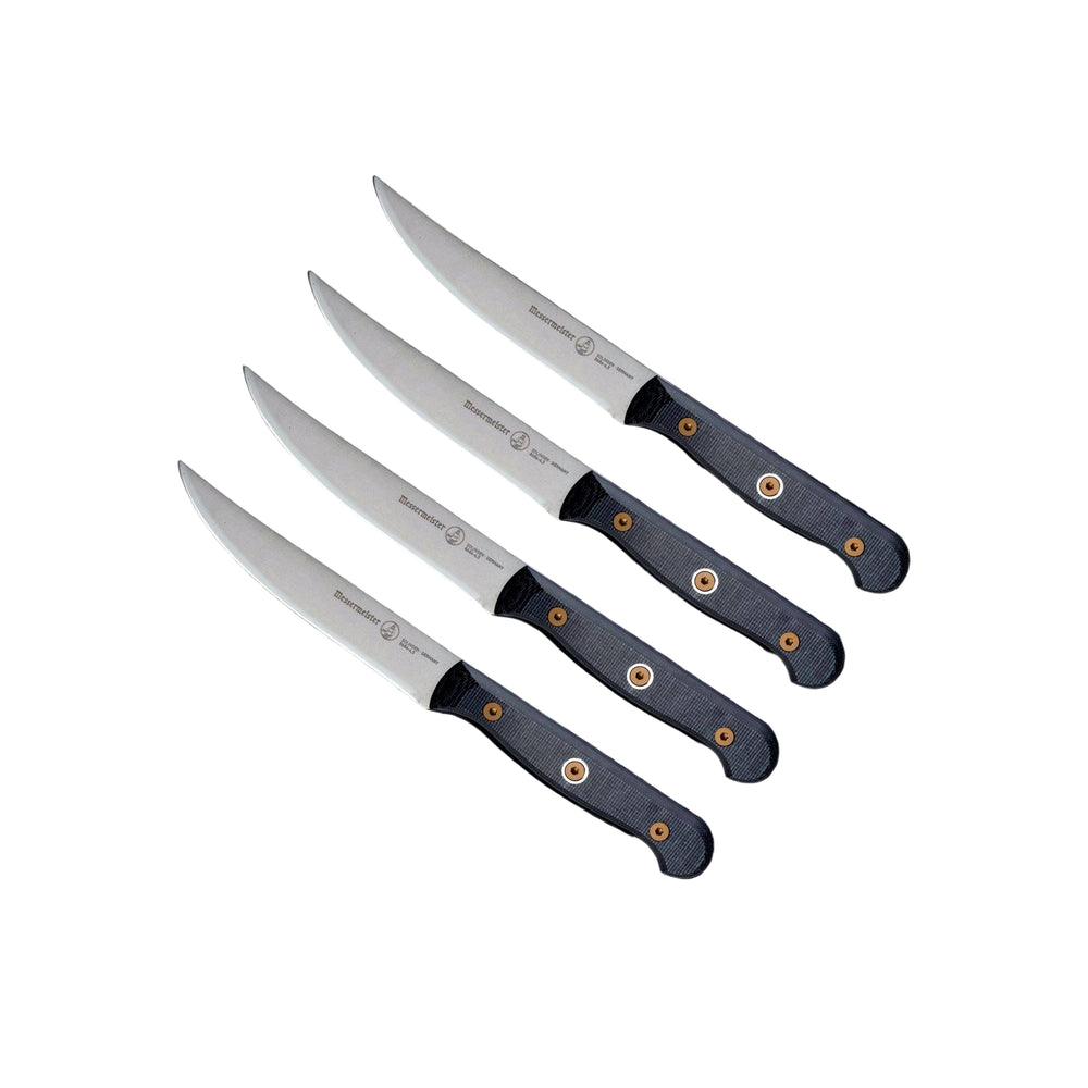 Angled upward view of Messermeister Custom steak knife set with 5-inch blades highlighting the precision-forged stainless steel blades, sharp cutting edges, and ergonomic modular handles with textured linen micarta handle