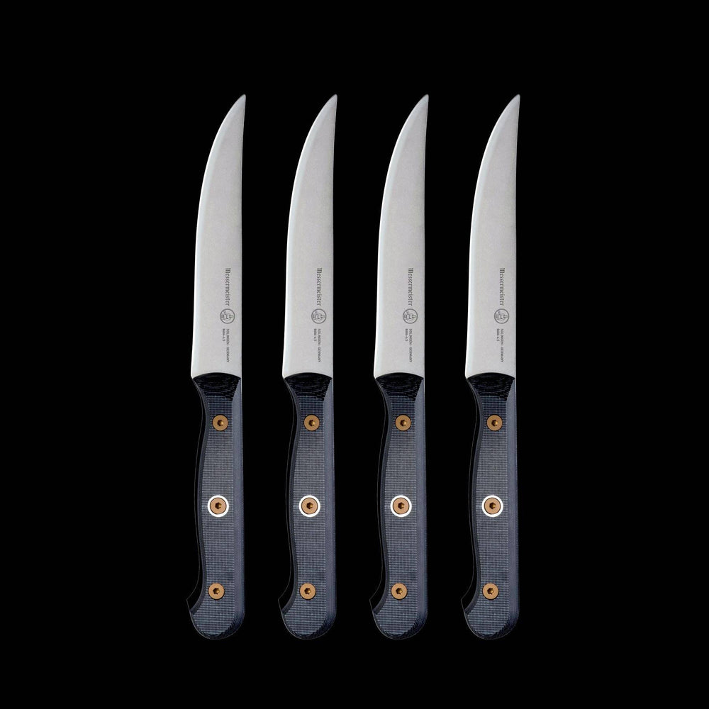 Upright view of Messermeister Custom steak knife set with 5-inch blades, showcasing precision-forged stainless steel blades, sharp cutting edges, and ergonomic modular handles with textured linen micarta handle