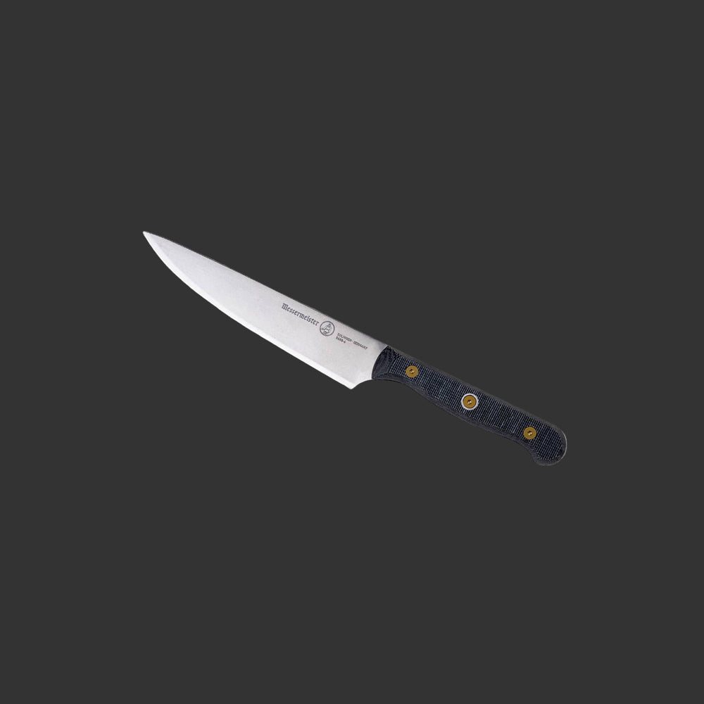 Messermeister Custom Utility Knife 6-inch angled upward, emphasizing the sharp blade and comfortable handle grip