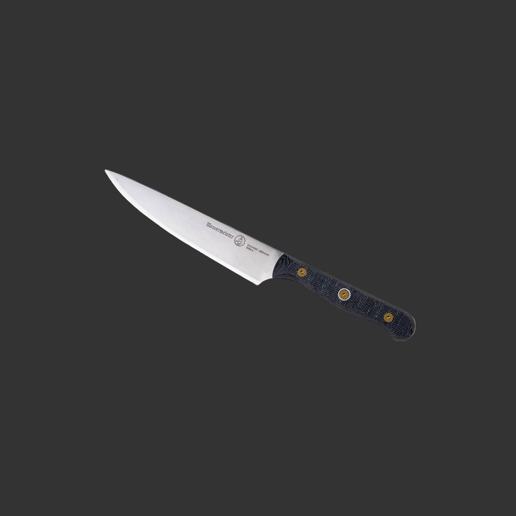Messermeister Custom Utility Knife 6-inch angled upward, emphasizing the sharp blade and comfortable handle grip