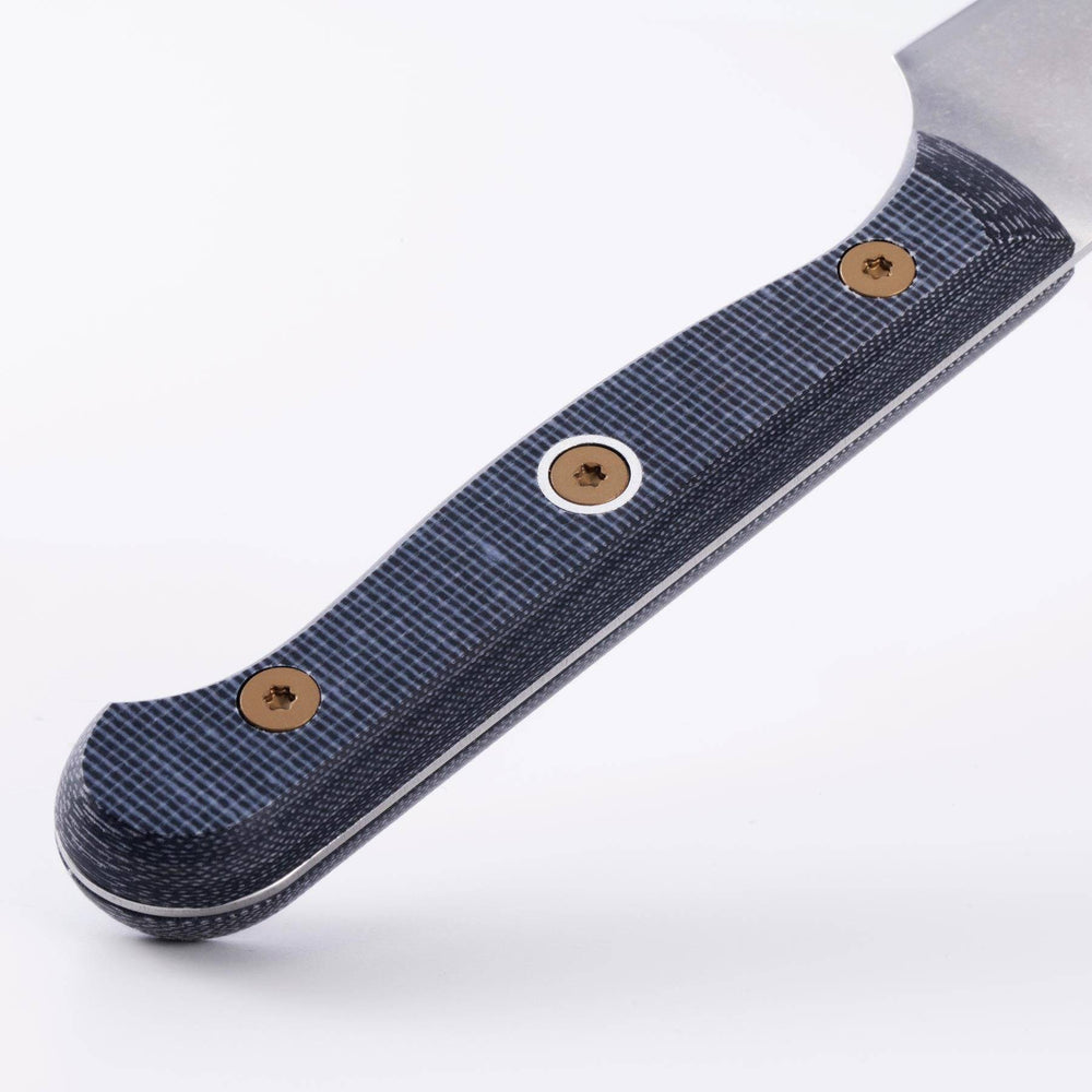 Messermeister Custom 6-inch utility knife angled down, showcasing its balanced handle, linen micarta texture and refined construction