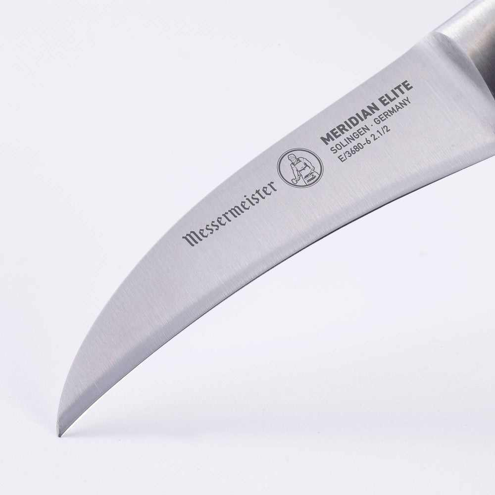 Meridian Elite Bird's Beak Garnishing Knife close up of the curved stainless steel blade and logo 