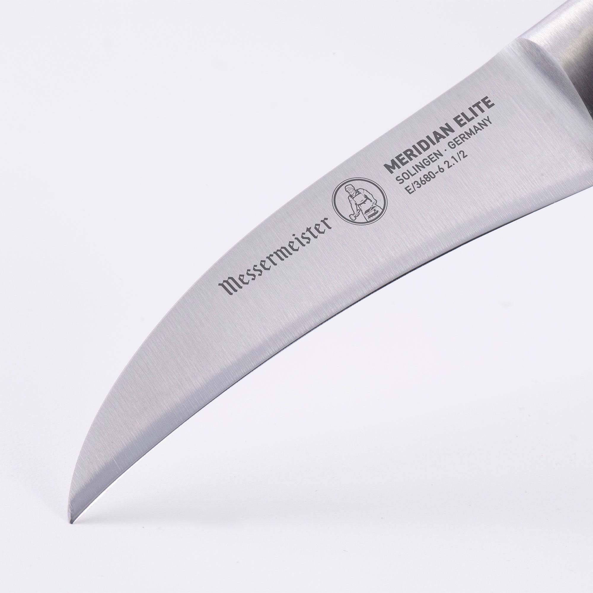 Meridian Elite Bird's Beak Garnishing Knife close up of the curved stainless steel blade and logo 