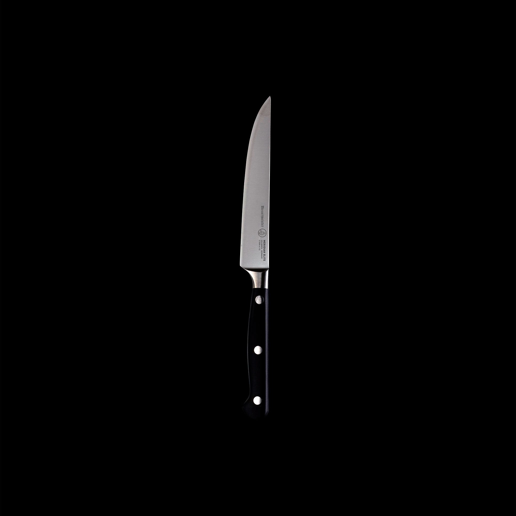 One of four Meridian Elite fine edge steak knives with triple rivet black handle and stainless steel blade