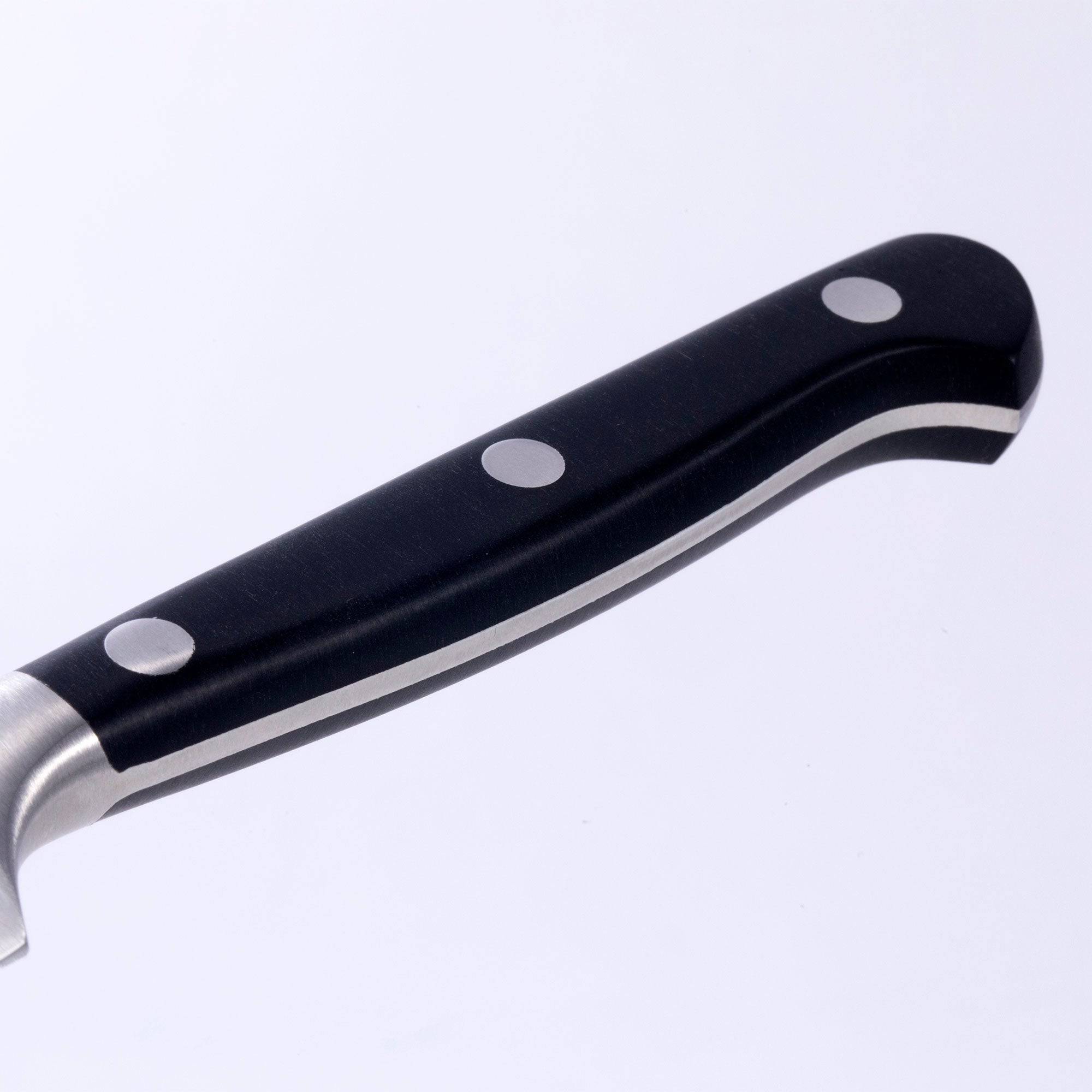 A close up view of the triple rivet black handle of the Meridian Elite fine edge steak knife 