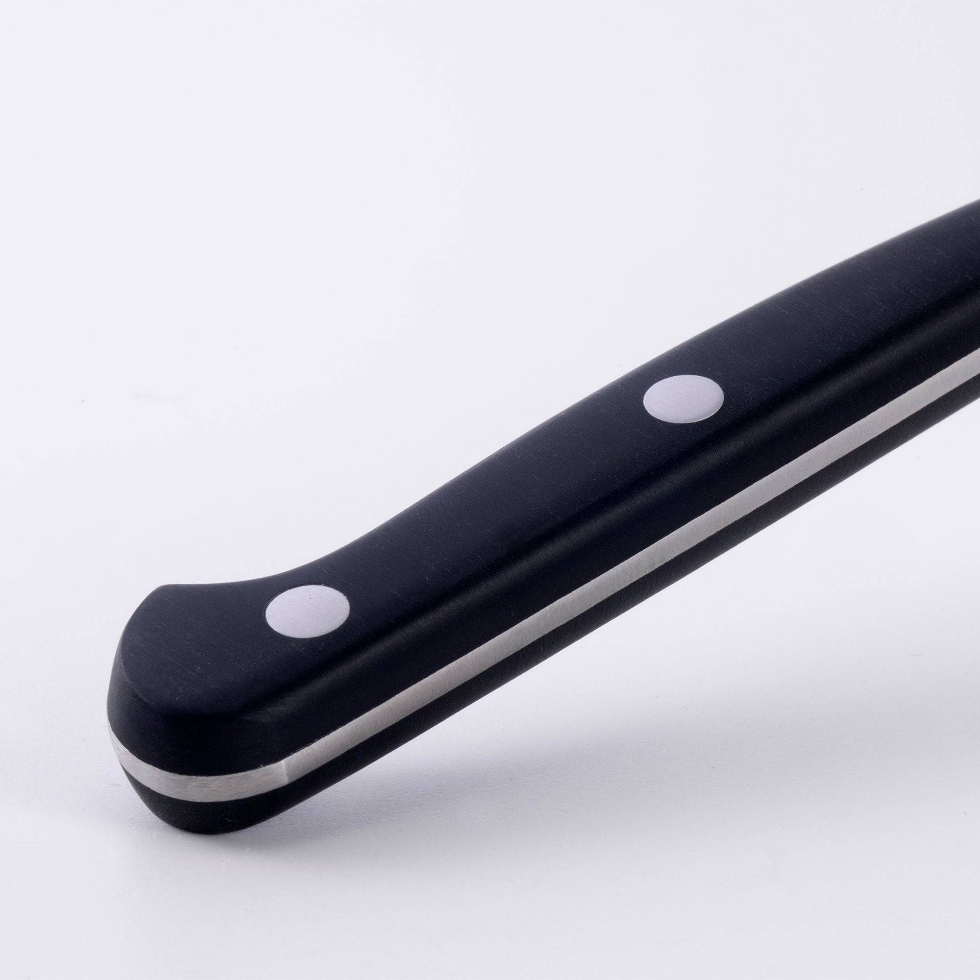 A close up view of the triple rivet black handle of the Meridian Elite fine edge steak knife 