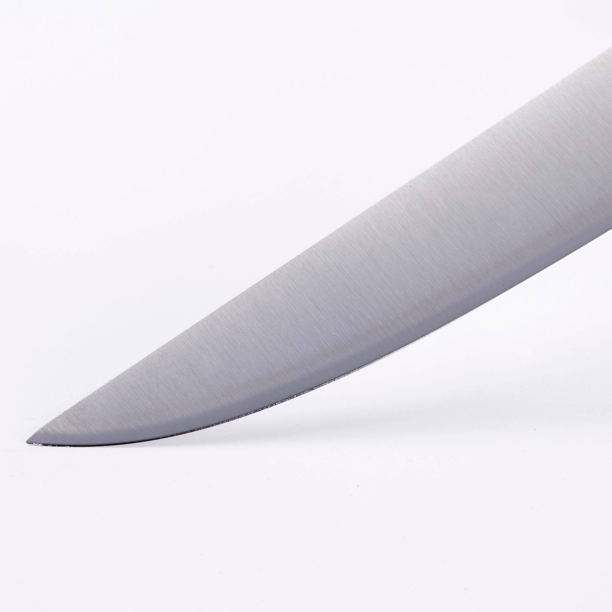 A close up view of the tip of the Meridian Elite fine edge steak knife 